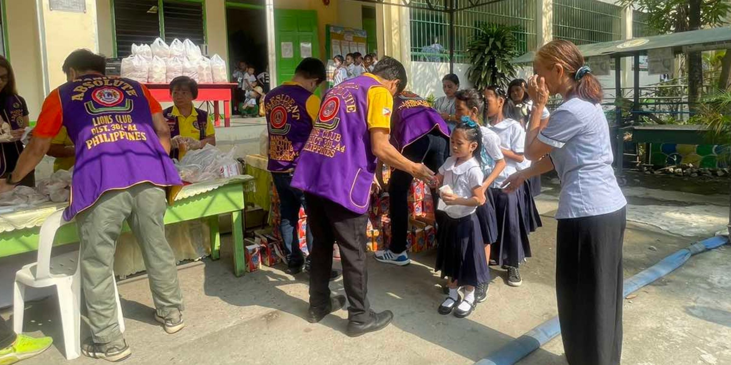 Volunteers assisting members of the community